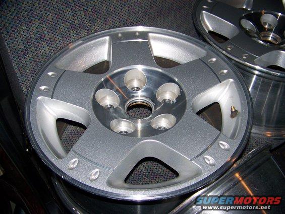 Silver 5-spoke rim with five lug nut holes