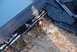 1996 Ford Bronco - Close-up view of damaged roofing materials, showing exposed plywood and shingles.