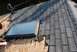 1996 Ford Bronco - Roof shingles are being replaced around a skylight during a repair job.
