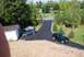 1996 Ford Bronco - A black hatchback, a teal sedan, and a gold sedan are parked on a driveway.