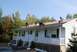 1996 Ford Bronco - Roof repair work in progress on a residential house with several people on the roof.