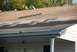 1996 Ford Bronco - Roof repair in progress with shingles and tools visible on the roof surface.