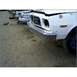 1973 Ford Ranchero - Several vehicles are parked in a dirt lot, showing their front ends and grilles.