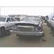 1973 Ford Ranchero - 1973 Ford Ranchero sits in a junkyard with a damaged front end and other cars nearby.
