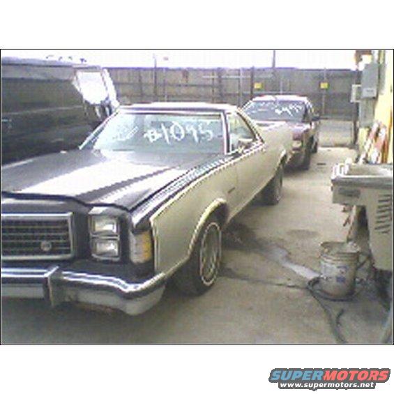 1977 Ford Ranchero and another car in a junkyard. #1095 written on windshield