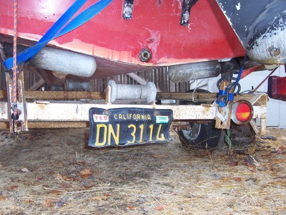 Boat on trailer with California license plate DN 3114 expiring Feb 2002