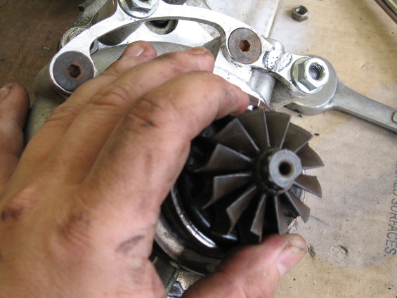 Turbocharger turbine wheel being held by a hand