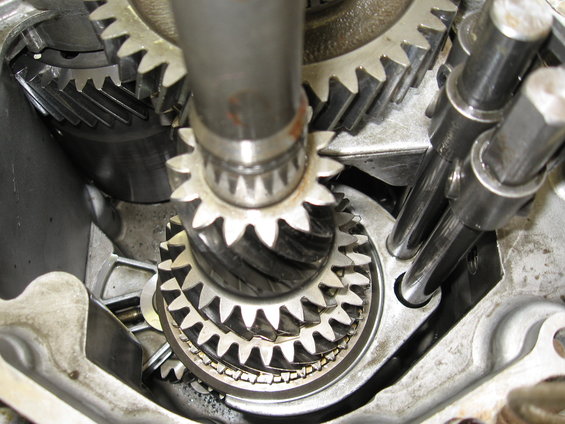 Close-up of transmission gears and shafts inside a gearbox