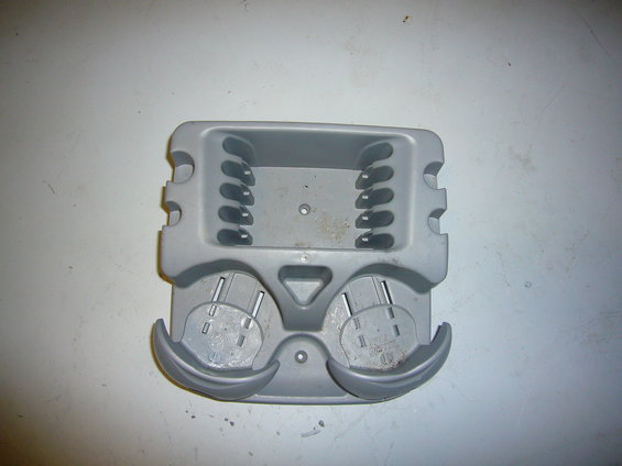 Gray plastic cup holder insert with two cup holders and slots for holding items