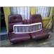 1973 Ford Ranchero - A white grille rests on top of two maroon car seats, possibly for a restoration project.