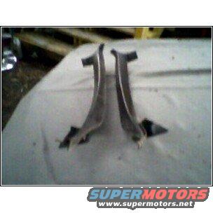 two curved metal trim pieces, possibly for a car