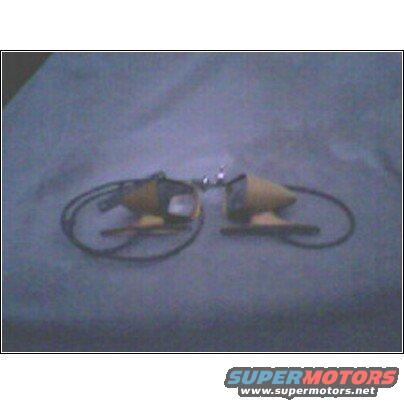 Pair of yellow and black automotive parts with wires