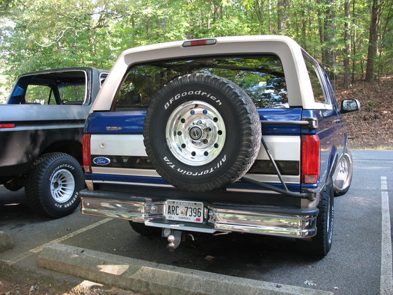 Blue Ford Bronco rear with spare tire, chrome bumper, and license plate ARC-7396