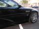 2002 BMW M3 - This black convertible, identified as a 2002 BMW M3, is shown from the front three-quarter angle, highlighting its distinctive fender vent…