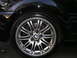 2002 BMW M3 - Close-up of a BMW wheel and fender, showing the distinctive alloy design and BMW badge.