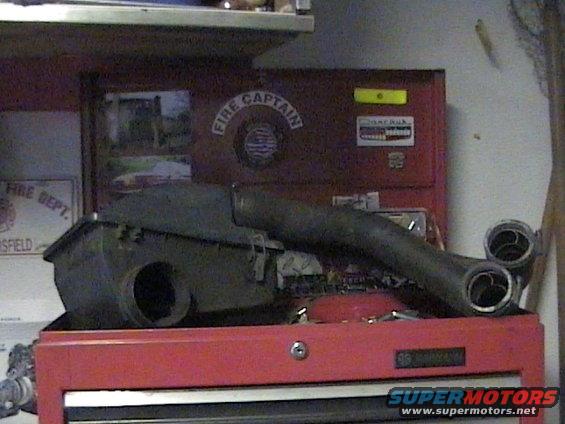 Exhaust manifold and air intake box on red toolbox