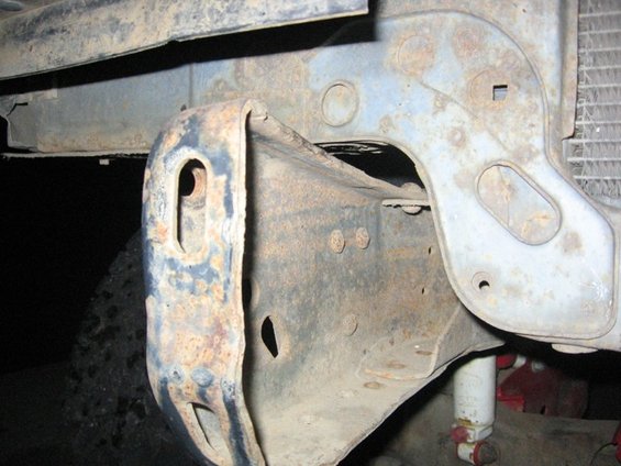 Rusted bumper bracket and frame detail