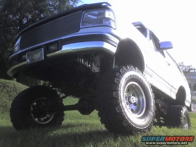 1995 Ford Bronco with lifted suspension and large off-road tires