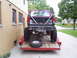 1994 Ford F-250 - Pickup truck with custom rear bumper and roll bar loaded onto a trailer.