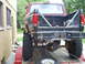 1994 Ford F-250 - This lifted Ford pickup truck is being transported on a trailer, its off-road modifications.