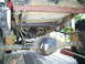 1994 Ford F-250 - The rear axle, leaf springs, and fuel tank of a 1994 Ford F-250 are visible from underneath.