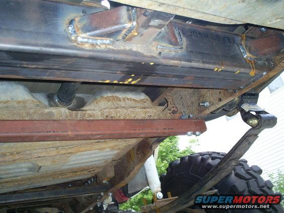 Truck undercarriage with custom frame welding and leaf spring suspension