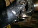 1994 Ford F-250 - Close-up of a driveshaft universal joint, showing wear and grease.