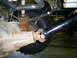 1994 Ford F-250 - Undercarriage view of a vehicle's rear suspension and drivetrain components.