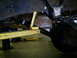 1994 Ford F-250 - Undercarriage view of a 1994 Ford F-250, highlighting suspension components and exhaust system.