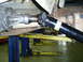 1994 Ford F-250 - Undercarriage view of a driveshaft and differential, with a second vehicle in the background.