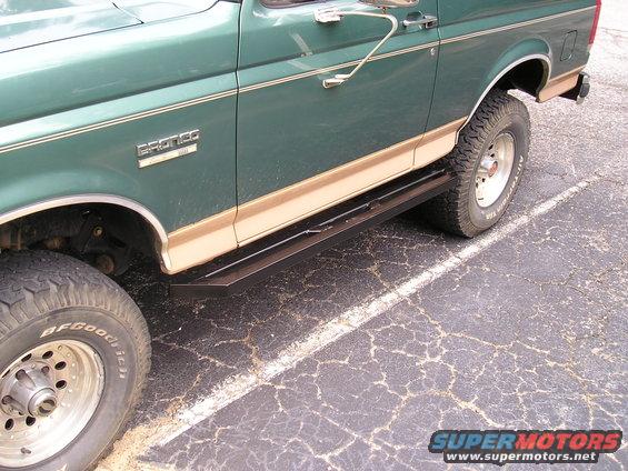 Green 1989 Ford Bronco side view showing running boards and BFGoodrich tires