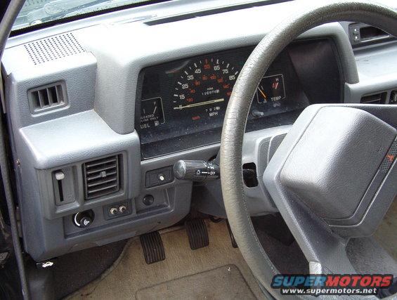 Interior dashboard with odometer showing 136974 miles and 78780 km