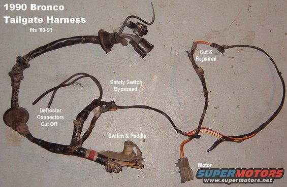 tgharness90.jpg SOLD Bronco Tailgate Wiring Harness from '90 fits '80-91

[url=http://www.supermotors.net/registry/media/930203][img]http://www.supermotors.net/getfile/930203/thumbnail/tgwiring.jpg[/img][/url]

Note repairs & missing terminals.

To add a simple self-diagnostic capability, wire a 12V lamp across the latch safety switch terminals, and mount it in the tailgate shell above the lock cylinder in the inside sill (through a carpet retainer hole if present).  If either control switch is activated, and the only thing preventing the glass from moving is the safety switch, the lamp will light and be visible to a person using either switch.