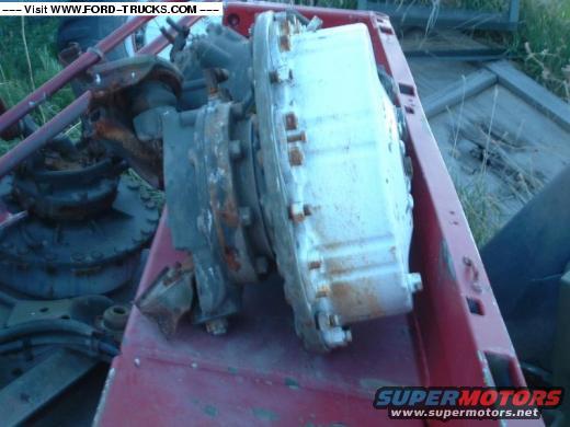 Transfer case part on red metal frame