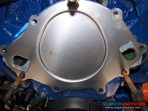 Here's the backing plate that came with the pump - the wrong one for my Bronco.  Good thing I noticed!!! The top of the driver's side inlet doesn't line up and is actually open to the timing cover (notice the small gap).