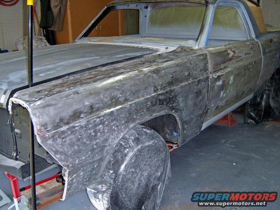 1967 Ford Ranchero body in primer, undergoing restoration, viewed from the front three-quarter angle