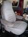 1978 Ford Bronco - A close-up view of a single vehicle seat, showing its fabric texture and armrests.