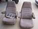1978 Ford Bronco - Two car seats are shown, one with a gauge cluster housing placed on it.