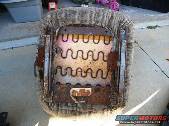 Car seat springs and frame showing wear and rust