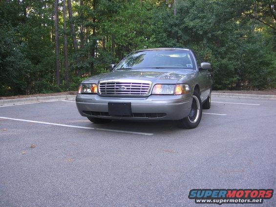 Gray 2000 Ford Crown Victoria parked in a lot, front view