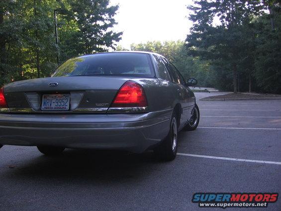 Rear view of a gray 2000 Ford Crown Victoria with a license plate reading KRV-9952