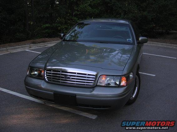 Front view of a silver 2000 Ford Crown Victoria parked in a lot