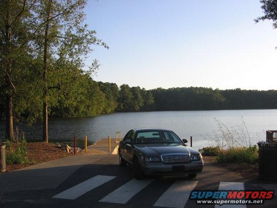 Gray 2000 Ford Crown Victoria parked on a boat ramp near a lake