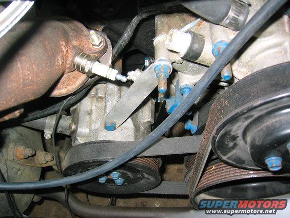 tractionltd-024.jpg The AC compressor bracket held the tensioner for the smog pump. It didn't anything anymore but I wanted to keep it as stock as possible so I made a pair of brackets to hold the pump in place and used a shorter belt. The spark plug just blocks the O2 sensor port though the O2 sensor is in there now and the others have regular plugs I made.

Later on I ditched all the smog equipment, converted to fuel injection, and lost the smog pump too. 