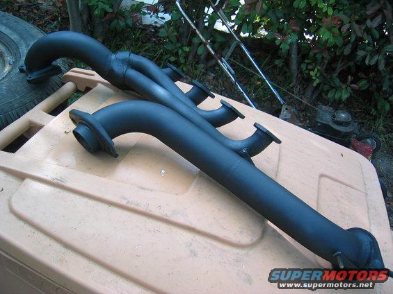 tractionltd-027.jpg Drivers side with the straps welded on and drying on the garbage can.