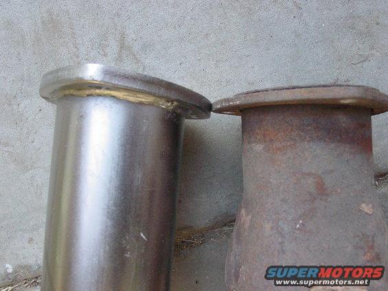 Two exhaust pipe flanges, one new and one rusty