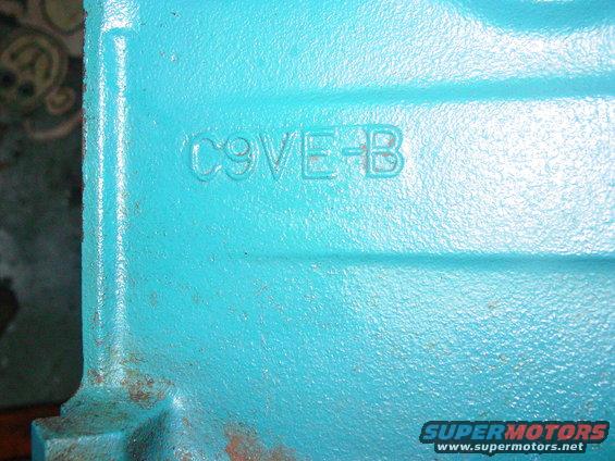 Close-up of a turquoise-painted metal casting with 'C9VE-B' stamped into it