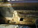 1989 Ford Bronco - The interior door panel of a vehicle is heavily covered in mud, obscuring most details.