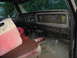 1989 Ford Bronco - The interior of this vehicle is covered in mud, with prominent Monster Energy decals on the dashboard.