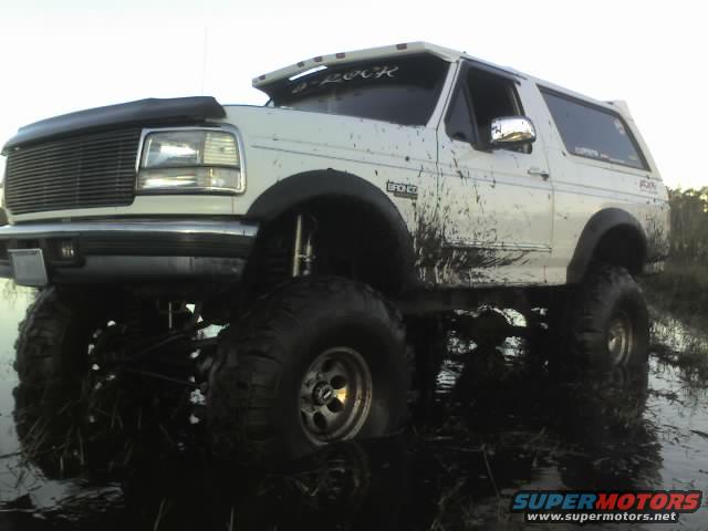 1995 Ford Bronco with large tires stuck in mud